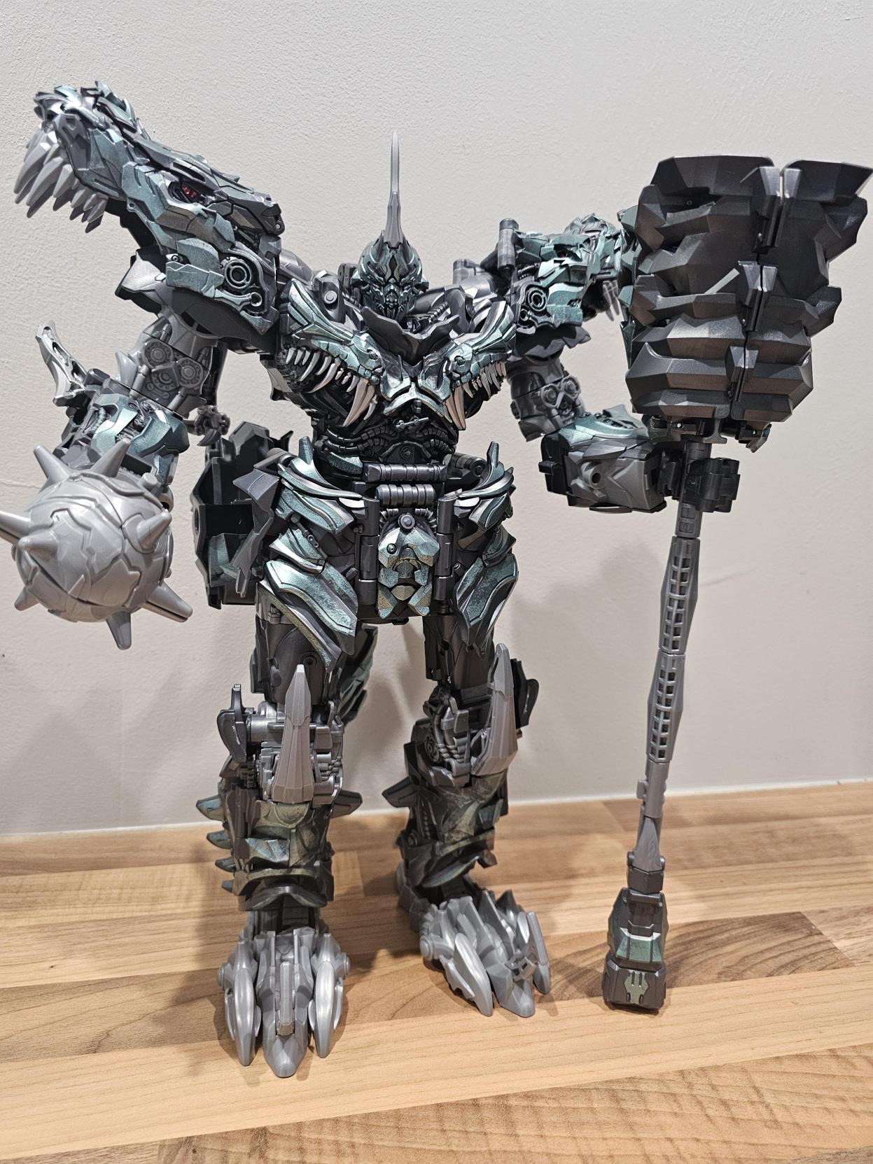 A picture of Titan Class Grimlock out of the box and fully complete with his mace and club